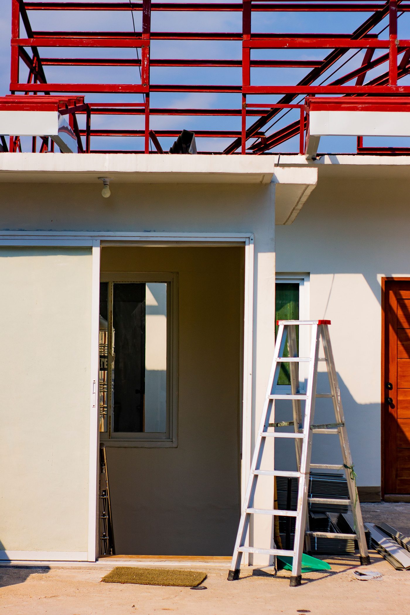 Residential structure undergoing renovation with scaffolding